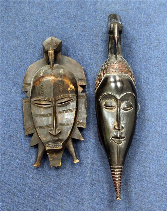 Two African carved wood masks; Senufo and Baule,  17in. and 25in.